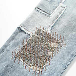 Herrenjeans mit Patchwork-Stickerei